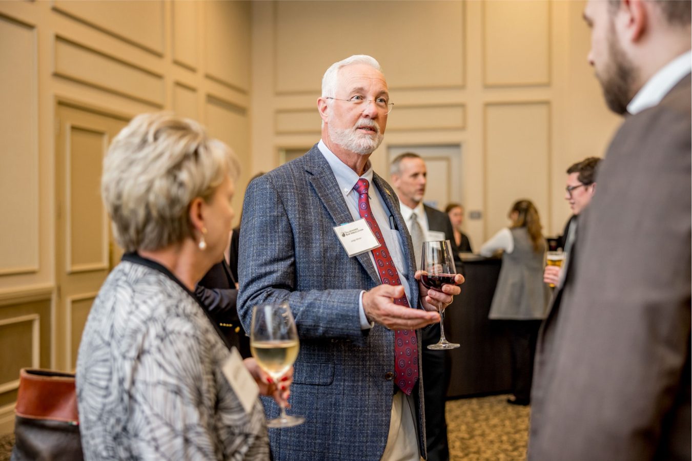 Guests connecting at a conference reception