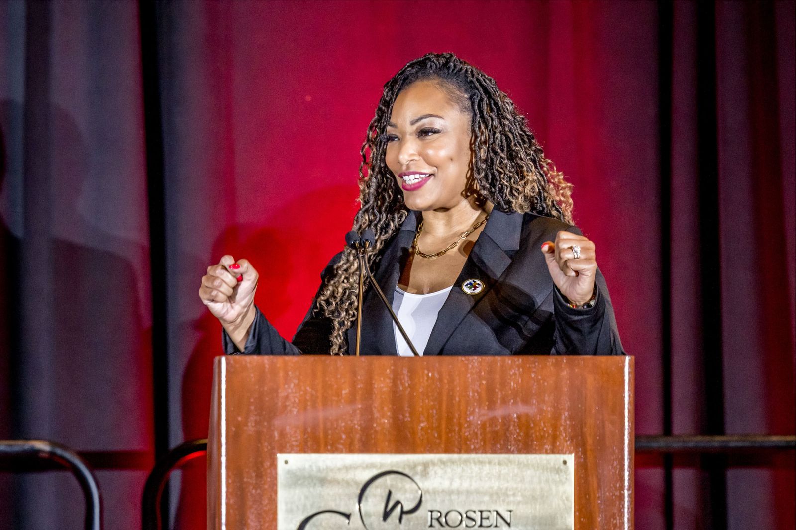 Speaker presenting on stage at a conference
